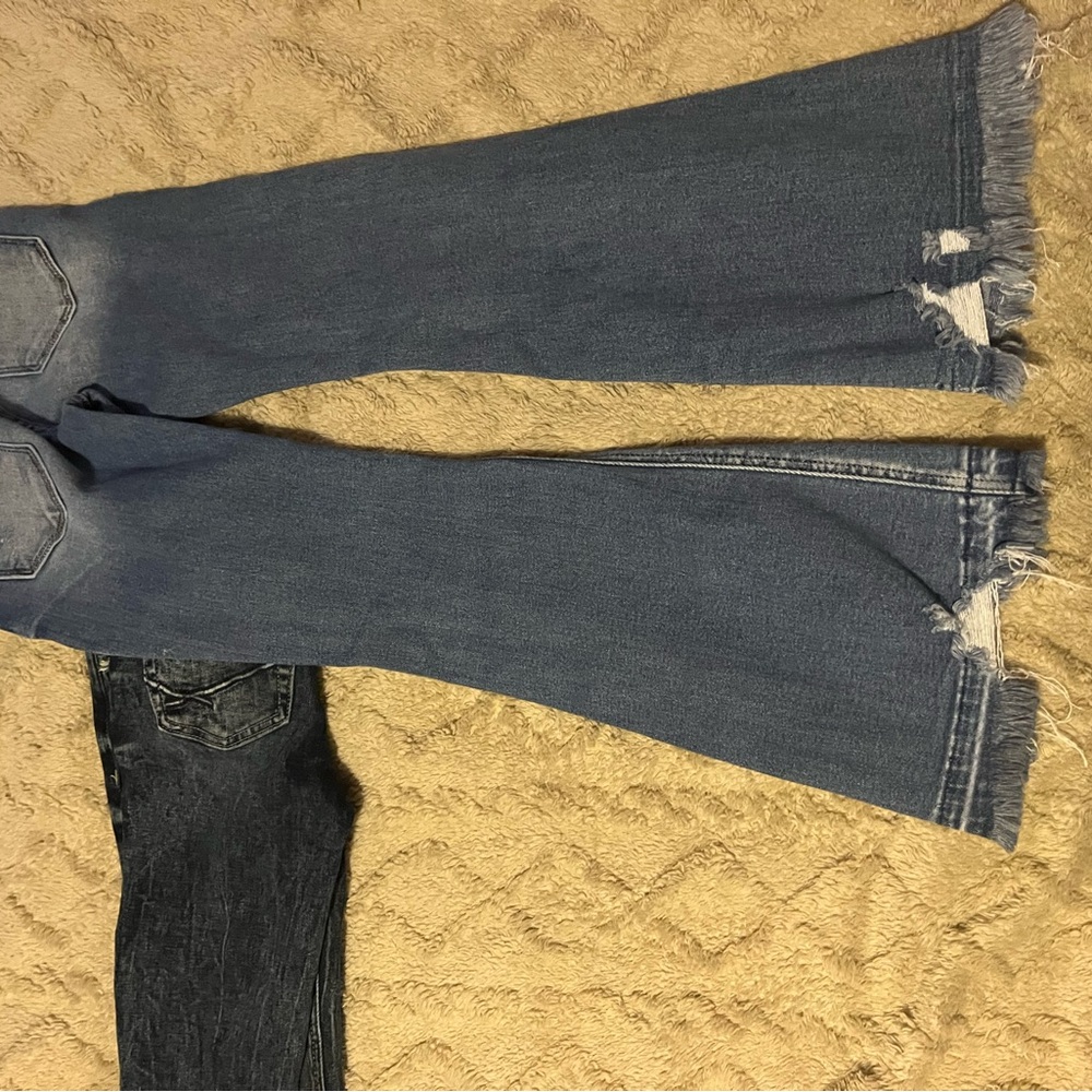 Flared Blue Jeans with Distressed Hem